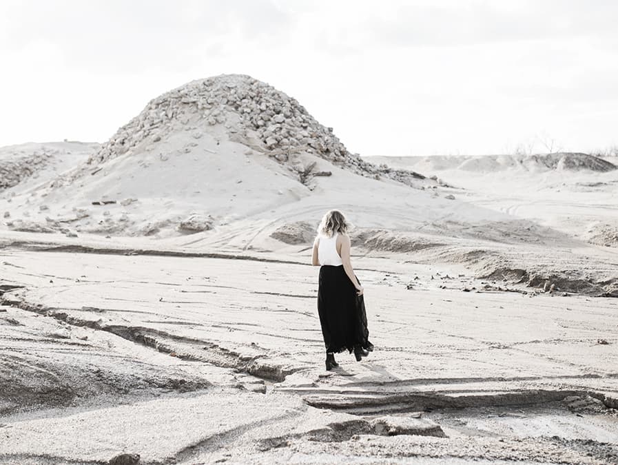 girl walking on the sand